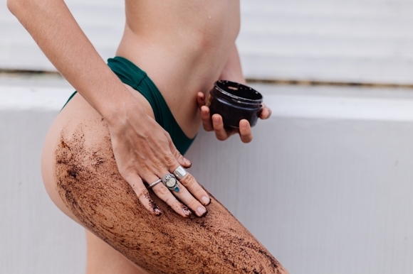 outdoor-shot-of-woman-with-coffee-body-scrub